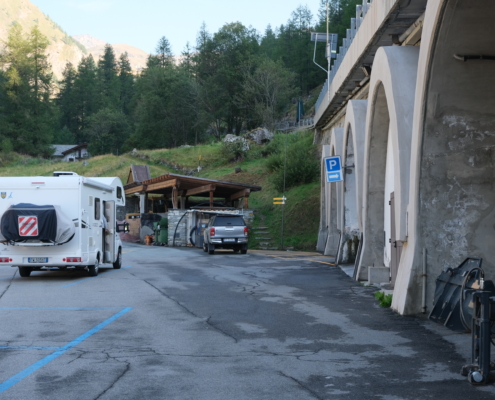 The entrance on the right at the end of the parking lot